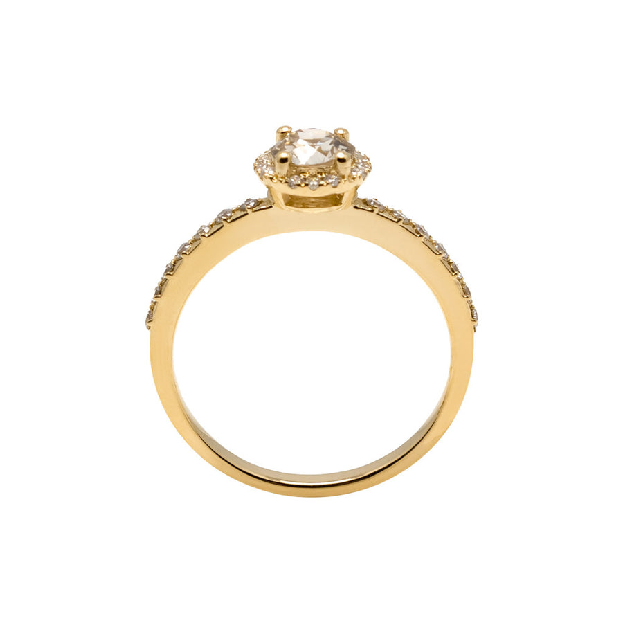 This is a side view of the Maya ring, an engagement ring that features an old european cut diamond with a halo and pavé band. 